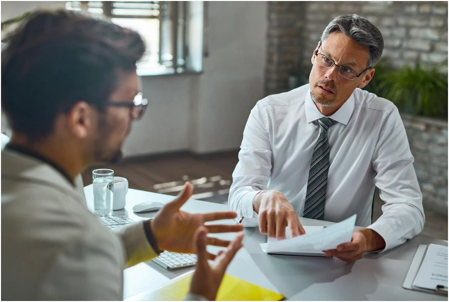 client consulting with an attorney on how to choose the best car accident lawyer