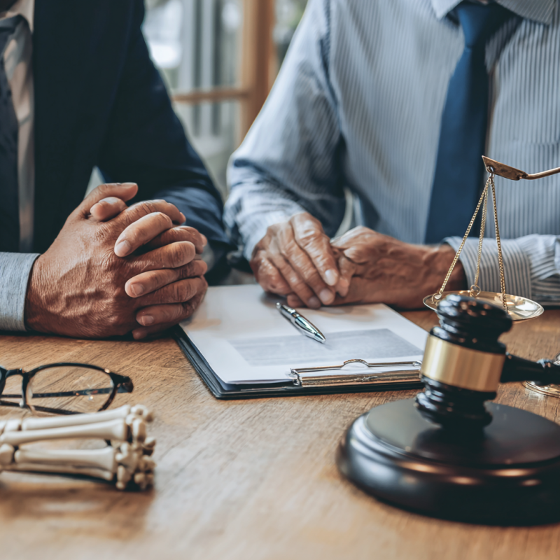 Injury lawyer in Kansas City meeting with client to discuss case