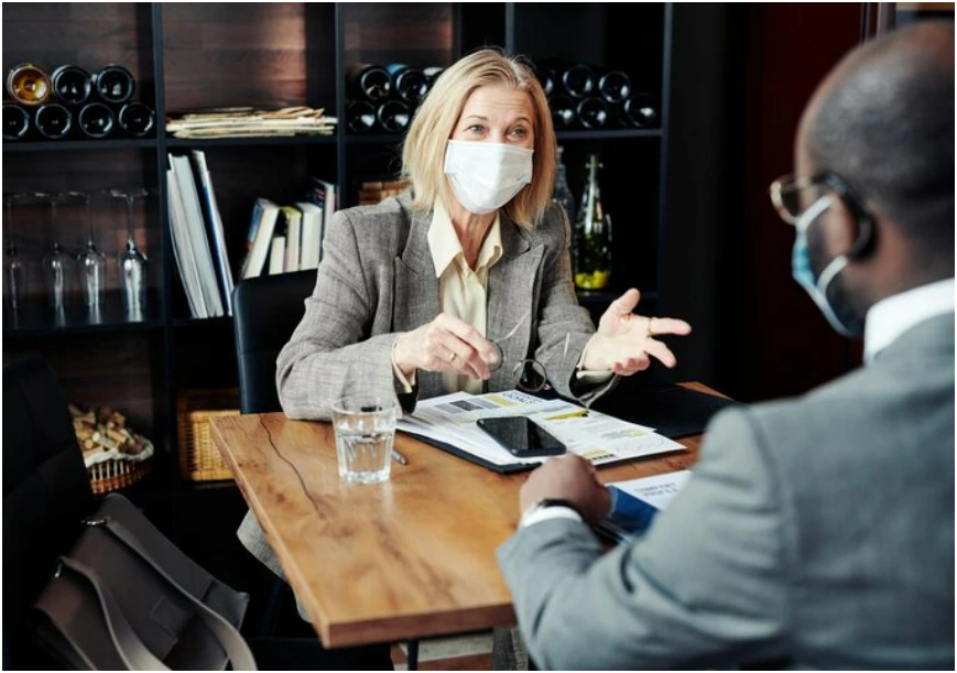 Driver reviewing accident documents with a lawyer after a car accident in Missouri or Kansas
